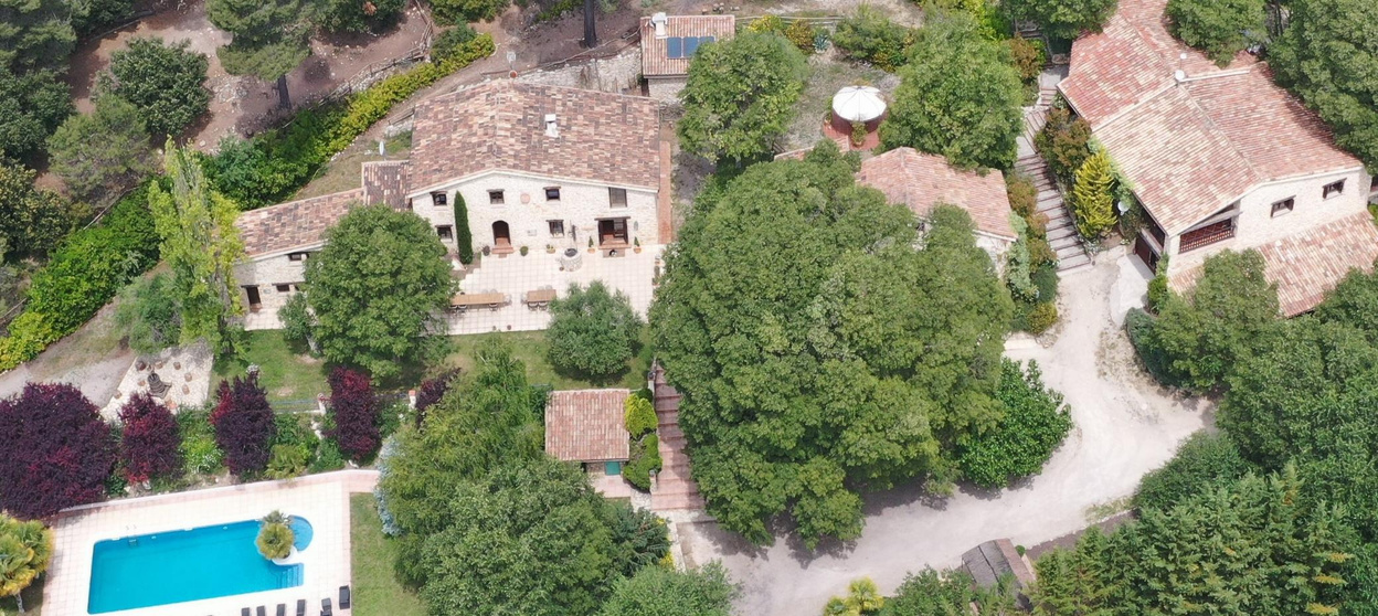 Aerial photograph of the Masia houses, courtyard and swimming pool